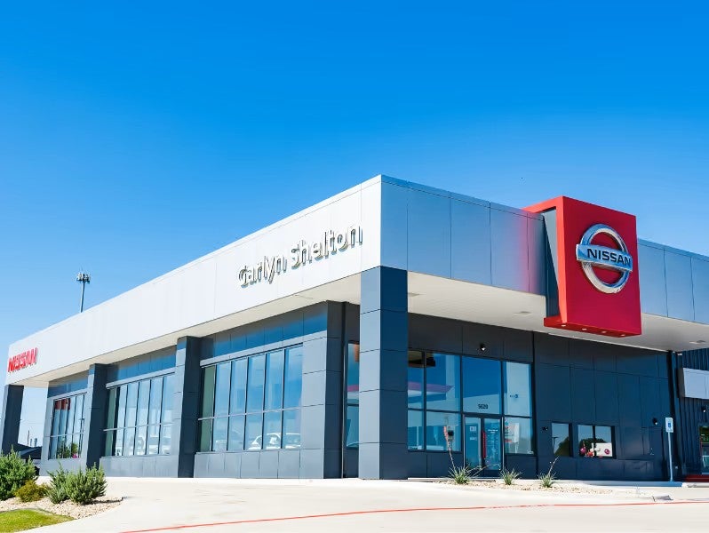 Exterior view of a modern Nissan dealership building